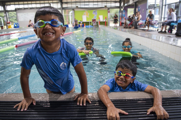 Twins Eesa and Aadil Kayani, six, having swimming lessons at Sydney's Holsworthy Aquatic Centre. 