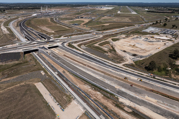 The new M12 motorway and road links to Western Sydney Airport (visible in the background), which will open next year.
