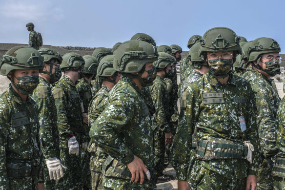 In Taiwan in July, soldiers perform military exercises.