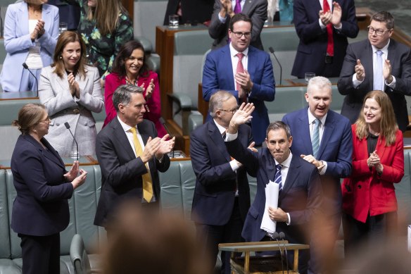 Treasurer Jim Chalmers is applauded by colleagues after his budget speech at Parliament House on Tuesday.
