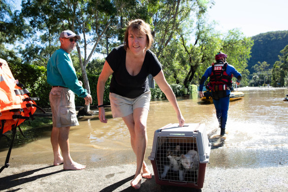 The SES rescue Angela Stewart and her pets from her home in Lower MacDonald. 