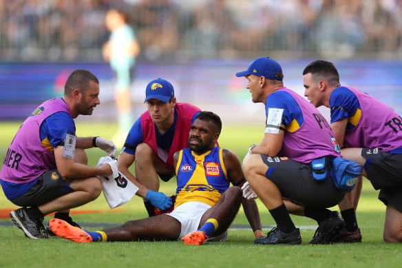 Liam Ryan gets help from the trainers before coming off the field in Sunday’s western derby.