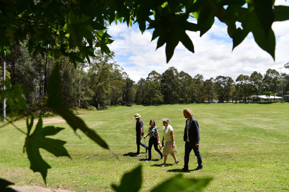 Quarry Creek Bushcare Group and Pymble residents Dale Crosby, Mignon Booth, Jill Green and Greg Taylor at the oval in 2021. Local environment groups say they needed more time to consider an environmental assessment.