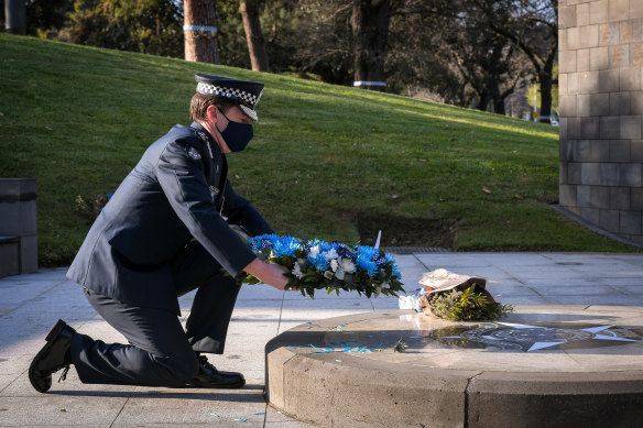 Chief Commissioner Shane Patton laying a wreath at the Victoria Police memorial.