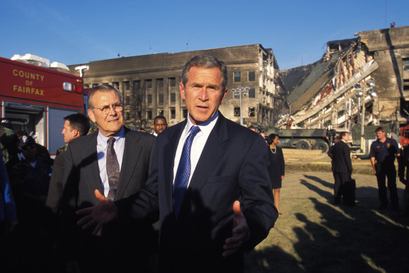 President George W. Bush and Secretary of Defence Donald Rumsfeld visit the Pentagon in Washington DC to view the damage the day after the September 11, 2001 attacks.