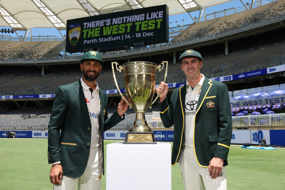 Pakistan captain Shan Masood and Australian counterpart Pat Cummins with the Benaud-Qadir Trophy in Perth.