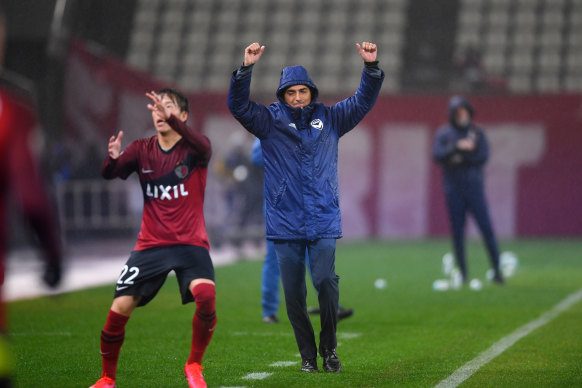Carlos Salvachua celebrates on the final whistle in Japan.