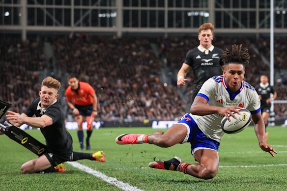 France’s Theo Attissogbe scores a memorable try against New Zealand in their Nations Championship match in Christchurch.