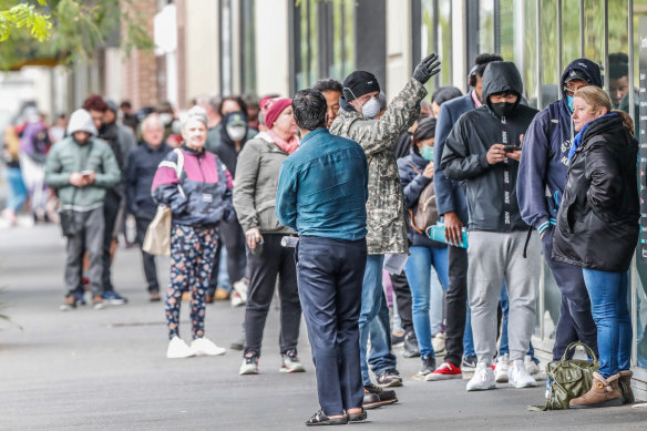 As the coronavirus pandemic took hold in Australia, thousands of people lost their jobs. Melburnians pictured here are lining up at Centrelink's South Melbourne office on March 25.