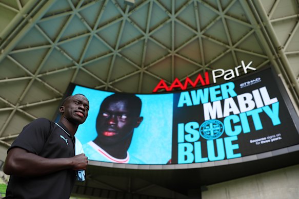 Socceroo and new Melbourne City signing Awer Mabil poses at AAMI Park on Wednesday.