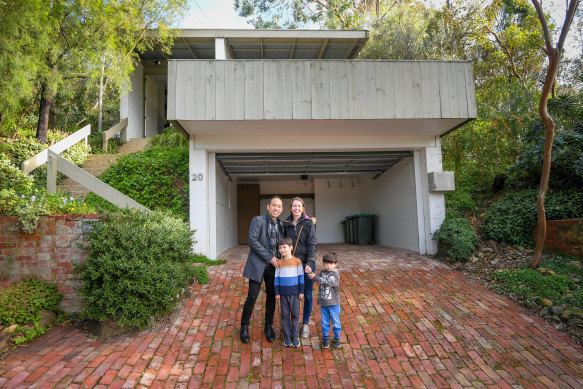 Auction winner Craig Tan with his family wife Gemma and children Ruben and Harrison and their  Robin Boyd house in East Ringwood.