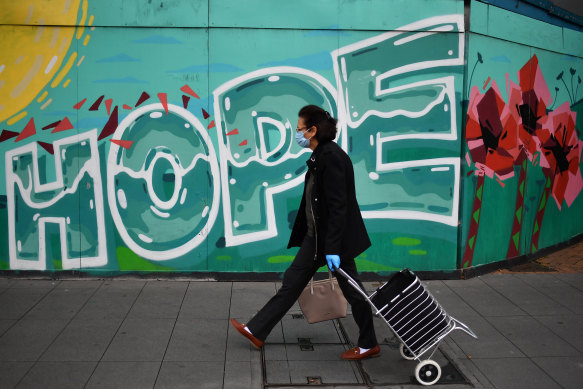 A shopper makes her once-a-day journey to Liverpool mall early on Saturday.