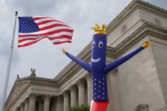 A stars and stripes balloon rises beside the National Archives, home to the Declaration of Independence, in Washington.