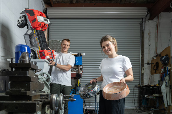 Sam Melrose and university intern Lily Bilston showing how a toy truck containing a cocktail of different plastics can be shredded and reused. 