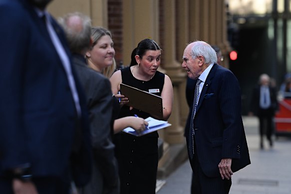 Former prime minister John Howard arrives at the church.
