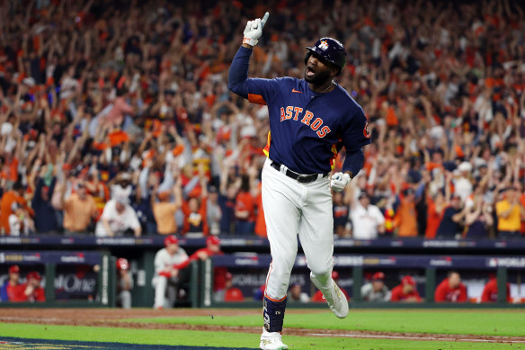 Yordan Alzarez celebrates his three-run homer to put the Astros ahead in game six of the world series.