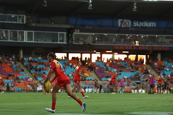Suns star Ben Long warms up as the sun sets behind the stand at TIO Stadium, Darwin.