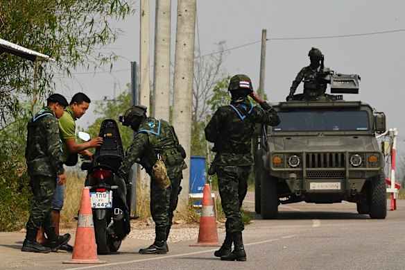 Thai soldiers carry out a search at a checkpoint in Mae Sot district, near the border with Myanmar.