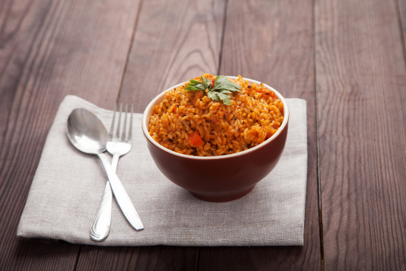 Jollof rice, with tomatoes and hot peppers.