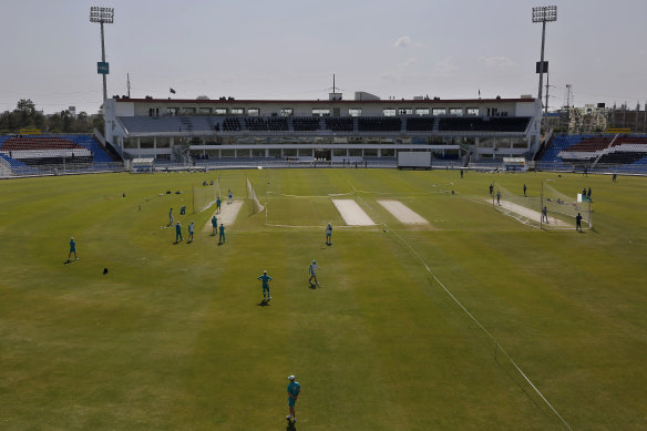 Pakistan, right, and Australia, left,  practice at the Rawalpindi Cricket Stadium.