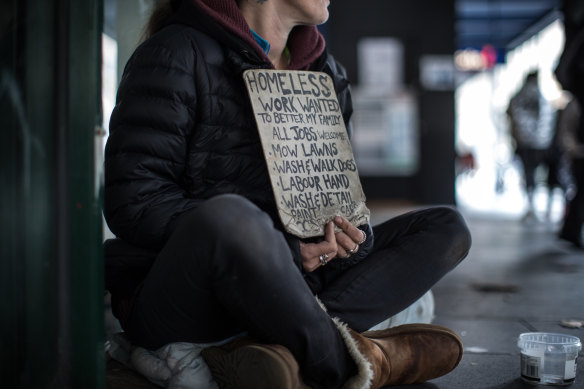 Homeless woman Rachel, 37, appeals for work on Elizabeth Street in May 2019.