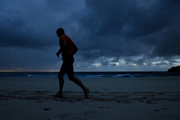 A man jogs along Bondi Beach in Sydney’s east on Wednesday morning. 