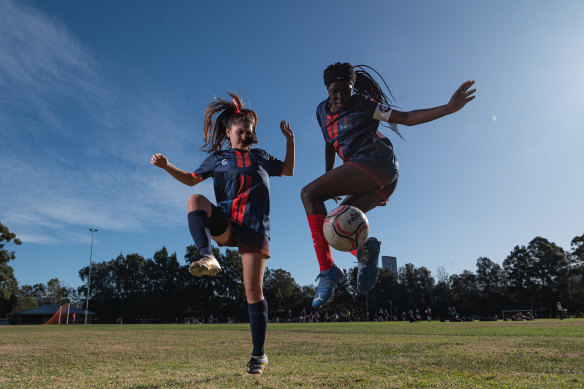 Trinity Catholic College students Maia Tuano, 16 and Abuk Nyor, 16.