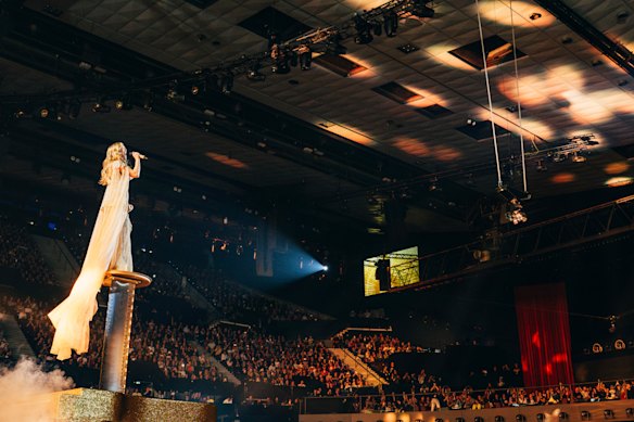 Behind the magic … viewed from behind the stage, Delta Goodrem on the Versa Ribbon Lift.