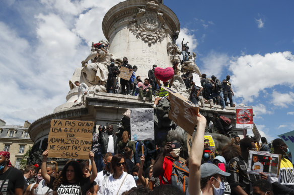 Thousands of people take part in a march against police brutality and racism in Paris, France, on Saturday June 13.