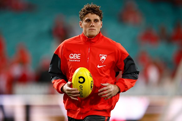 Charlie Curnow of the Swans warms up.