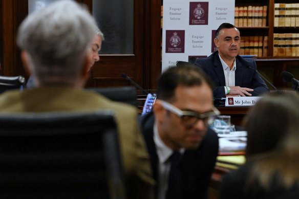 John Barilaro (right) giving evidence during the inquiry and Labor’s Daniel Mookhey (centre).