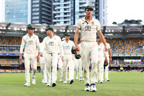 A frustrated Pat Cummins leads his team off at stumps.