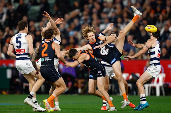 Mark Blicavs and Nick Haynes compete for the ball.