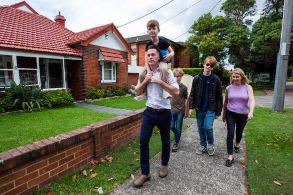 NSW Premier-elect Chris Minns with his family on Sunday morning.