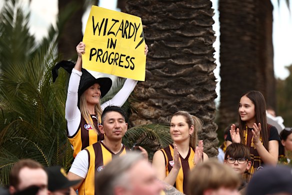 A Hawks fan with a Nick Watson banner.