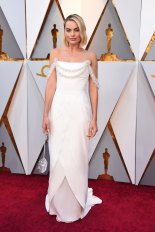 Margot Robbie arrives at the Oscars in Chanel as their latest ambassador.