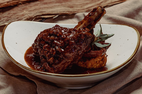 Braised wallaby shanks with native infused tomatoes and sweet potato roesti.