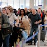 Air travellers endure long lines and two-hour wait times at the TSA security check point at the George Bush Intercontinental Airport on Friday.