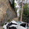 Driver’s miracle escape after car plunges 12 metres over inner-Sydney cliff