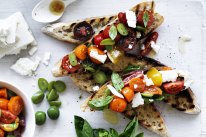 Neil Perry’s bruschetta with cherry tomatoes, basil, olives and feta.