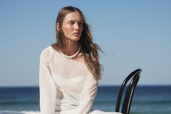 Beare Park “Joyce” dress, $820. Venroy “Balconette” bikini top, $140. Model’s own jeans.