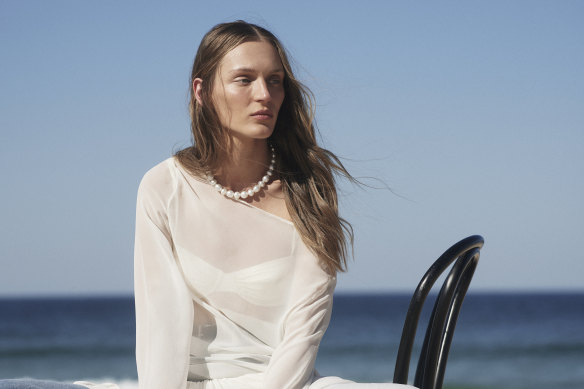 Beare Park “Joyce” dress, $820. Venroy “Balconette” bikini top, $140. Model’s own jeans.