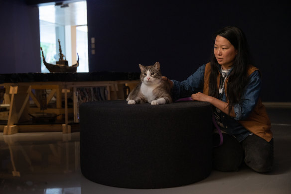 Artist Candice Lin with Kovu the cat.