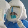Medical staff work in the negative-pressure isolation ward in Jinyintan Hospital, designated for critical COVID-19 patients, in Wuhan.