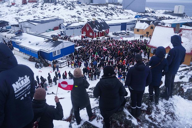 People protest against Trump’s policy towards Greenland in front of US consulate in Nuuk, Greenland, overnight.