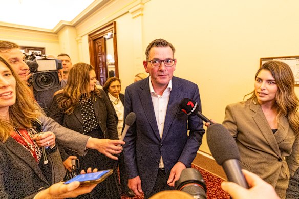 Andrews emerges from the caucus meeting.