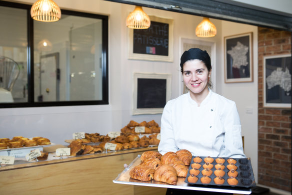 Agathe Kerr with some of the offerings that have put her South Melbourne market pâtisserie stall on the international tourist map, thanks to TikTok.