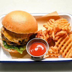 Double cheeseburger with waffle fries.