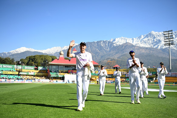 Jimmy Anderson leaves the field after claiming his 700th Test wicket, in India in March.