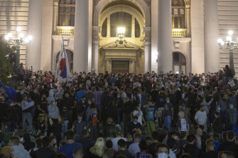 Protesters gather in front of the Serbian parliament in Belgrade on Tuesday night.